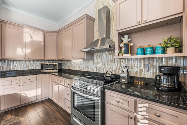 kitchen featuring appliances with stainless steel finishes, dark stone countertops, ornamental molding, decorative backsplash, and wall chimney exhaust hood