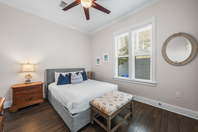 bedroom featuring ornamental molding, dark hardwood / wood-style floors, and ceiling fan