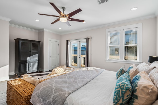 bedroom featuring hardwood / wood-style flooring, crown molding, access to outside, and french doors