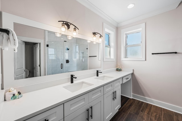 bathroom with ornamental molding, wood-type flooring, vanity, and walk in shower