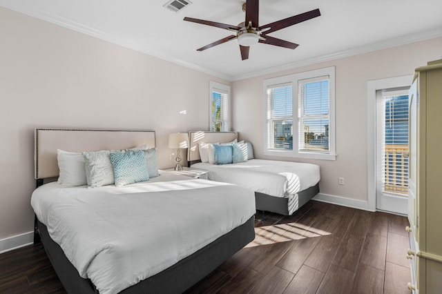 bedroom with dark wood-type flooring, ceiling fan, and ornamental molding