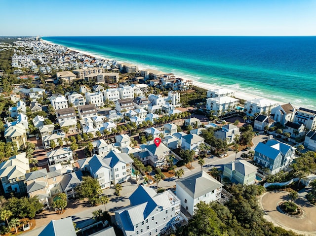 bird's eye view with a water view and a view of the beach