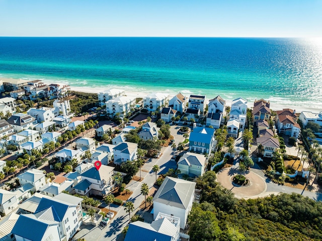 aerial view featuring a view of the beach and a water view