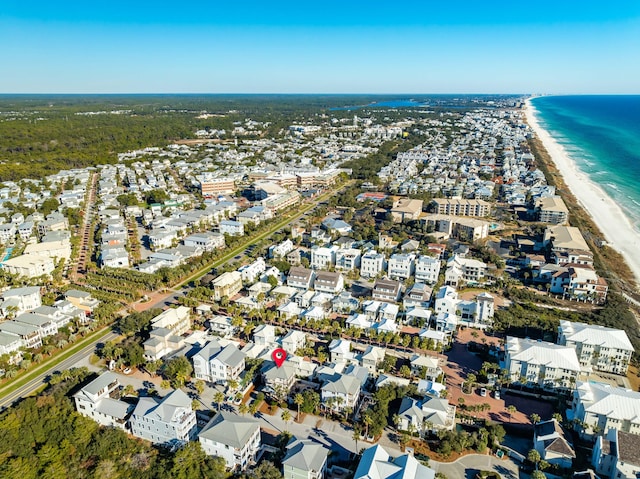 aerial view with a water view and a view of the beach