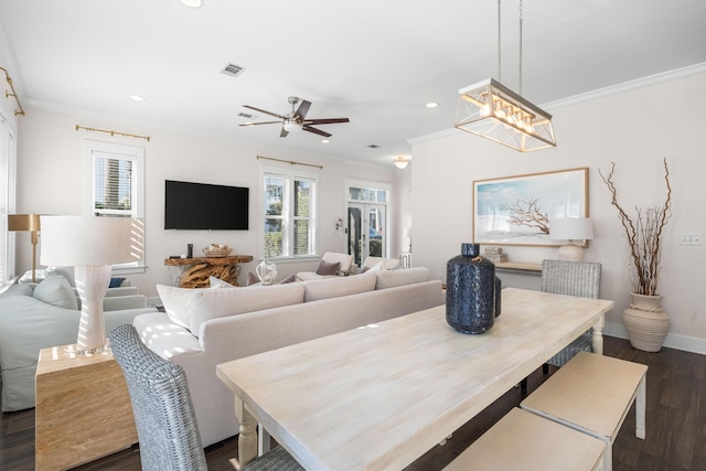 dining space featuring crown molding, dark hardwood / wood-style floors, and ceiling fan