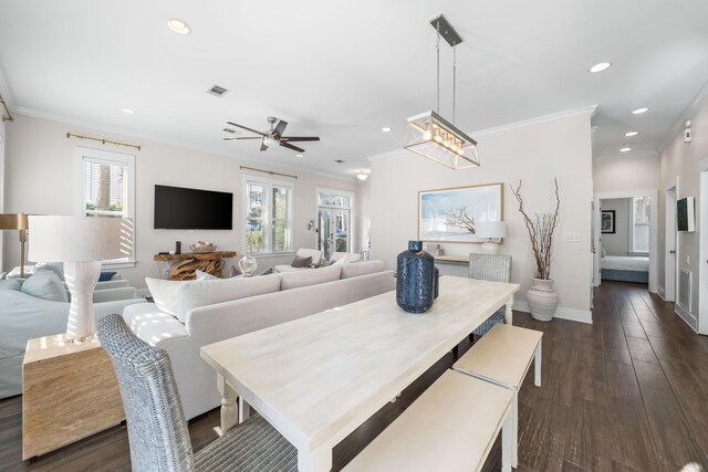 dining area featuring ornamental molding, plenty of natural light, dark wood-type flooring, and ceiling fan