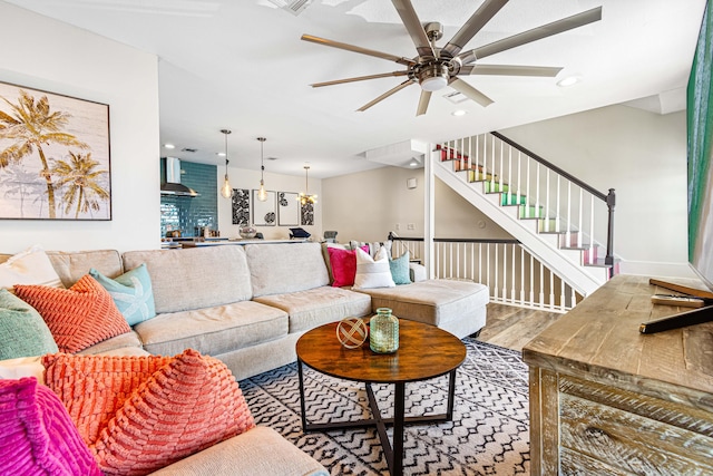 living room with ceiling fan and hardwood / wood-style floors