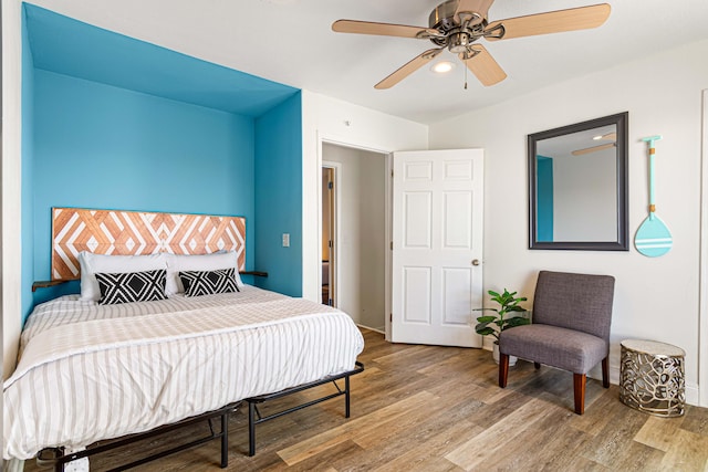 bedroom featuring ceiling fan and hardwood / wood-style floors