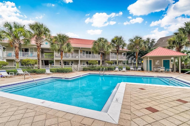 view of swimming pool with a patio