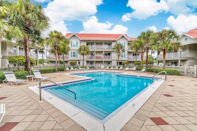 view of swimming pool featuring a patio area