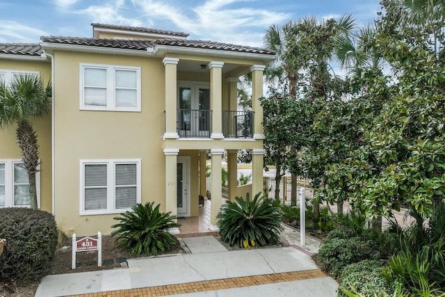 mediterranean / spanish-style home featuring a balcony