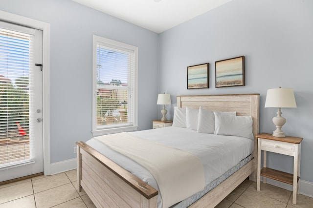 tiled bedroom with access to outside