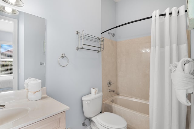 full bathroom featuring toilet, vanity, and shower / bathtub combination with curtain