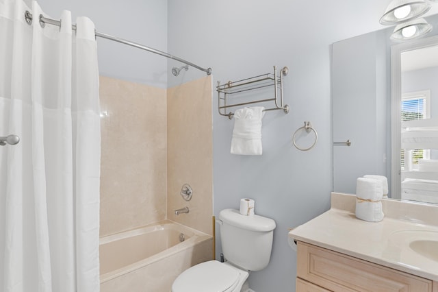 full bathroom featuring vanity, shower / tub combo, and toilet