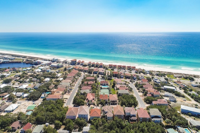 aerial view featuring a view of the beach and a water view