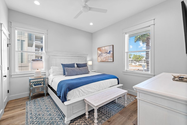 bedroom featuring ceiling fan and light hardwood / wood-style flooring