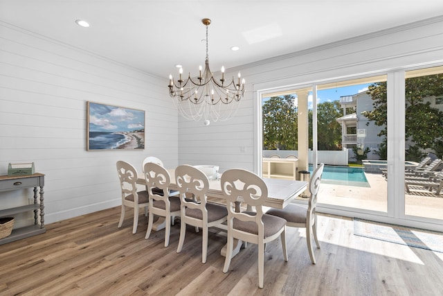 dining room featuring a chandelier and hardwood / wood-style floors