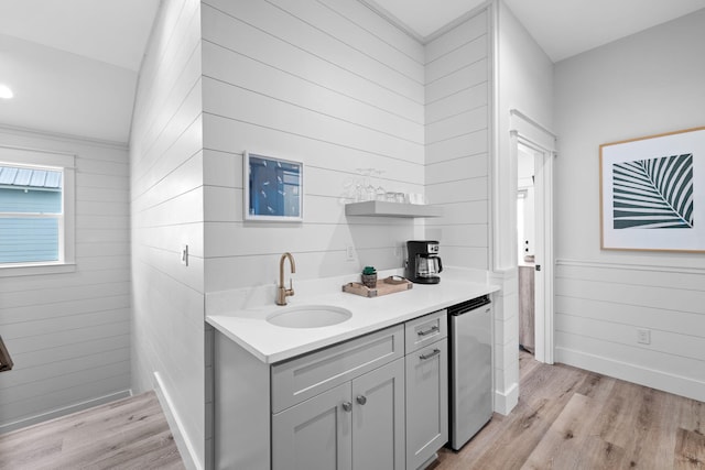 bathroom with vanity and hardwood / wood-style floors