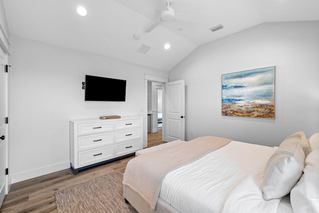 bedroom with lofted ceiling, hardwood / wood-style floors, and ceiling fan