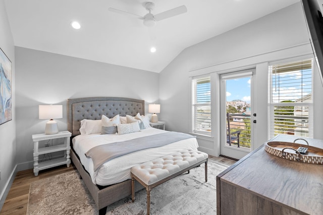 bedroom featuring vaulted ceiling, hardwood / wood-style flooring, ceiling fan, and access to exterior