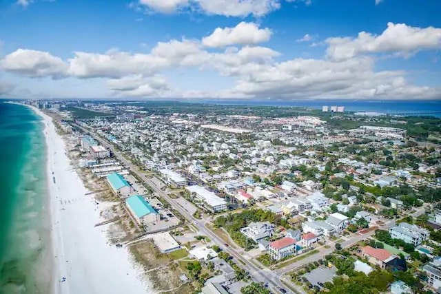 birds eye view of property featuring a water view and a view of the beach