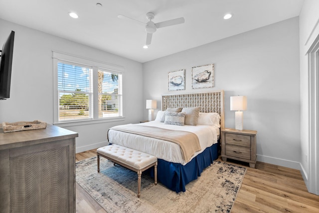 bedroom featuring ceiling fan and light hardwood / wood-style floors