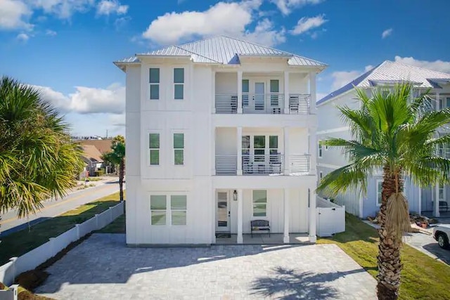 view of front of home with a balcony