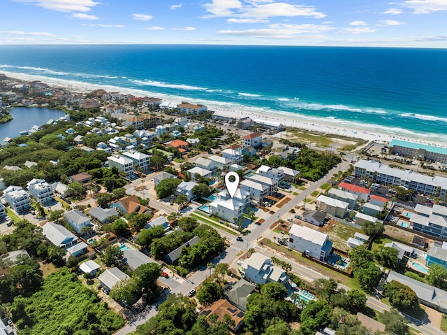 bird's eye view featuring a water view and a view of the beach