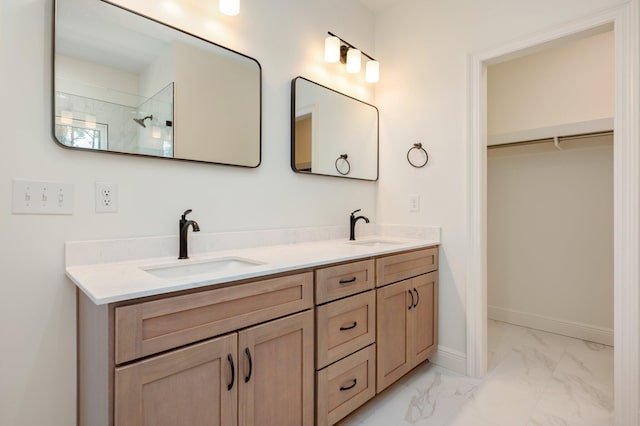 bathroom with vanity and a shower