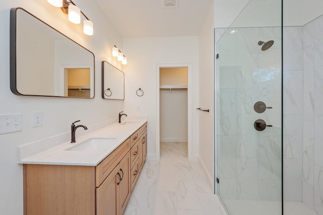 bathroom featuring vanity and a tile shower