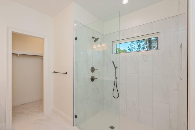 bathroom with tiled shower