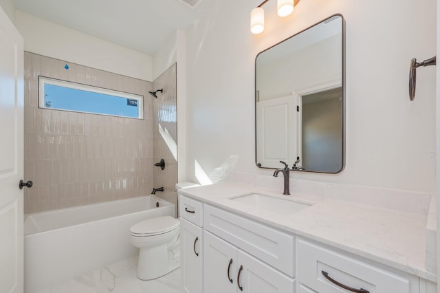 full bathroom with toilet, tiled shower / bath combo, and vanity