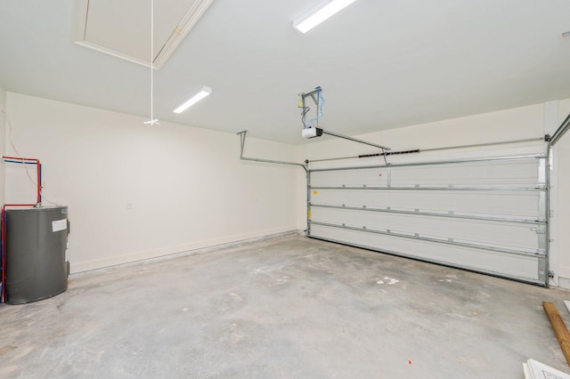 garage featuring water heater and a garage door opener