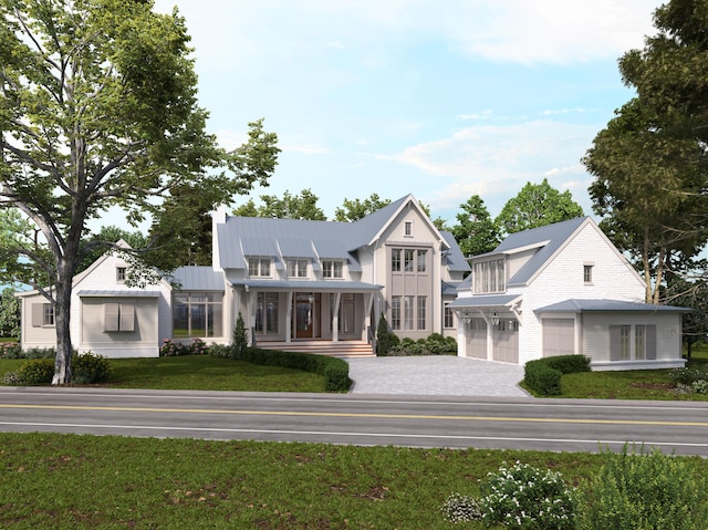 view of front of property with covered porch, a front lawn, and a garage