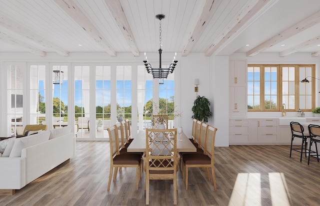 dining area with hardwood / wood-style floors, a chandelier, beam ceiling, and wood ceiling