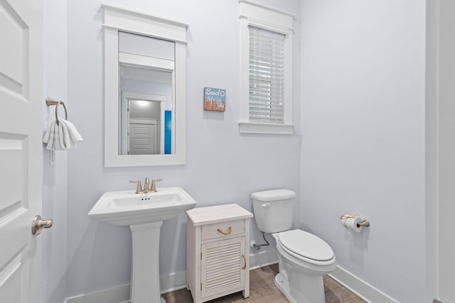 bathroom featuring toilet and hardwood / wood-style floors