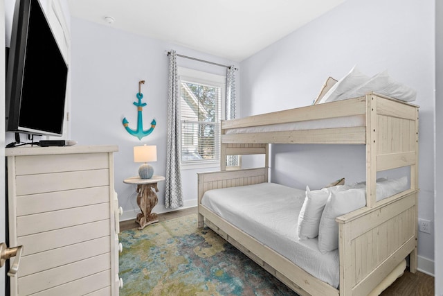 bedroom featuring dark hardwood / wood-style flooring