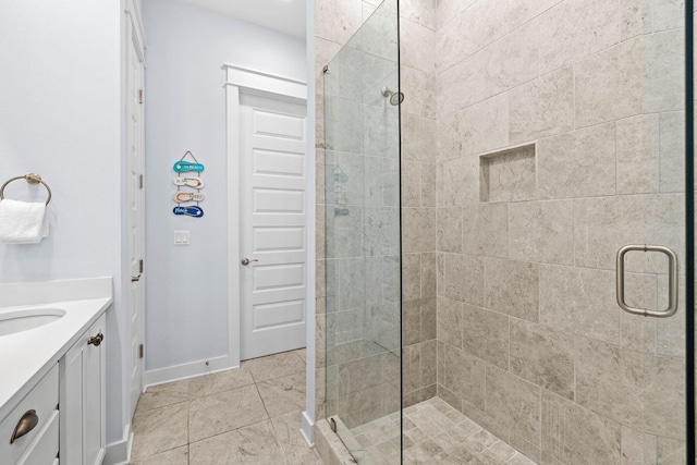 bathroom featuring walk in shower and vanity