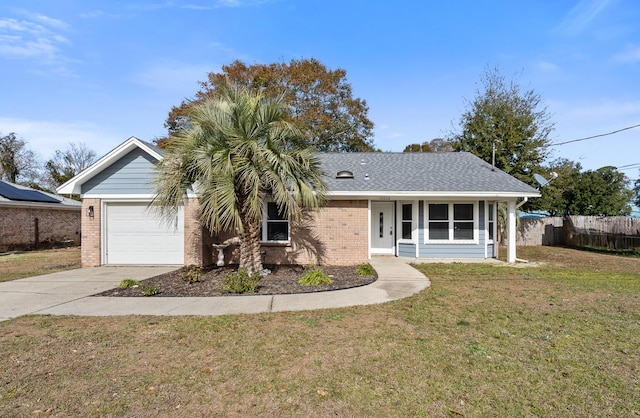 ranch-style home with a front yard and a garage