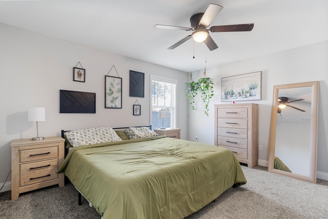 carpeted bedroom featuring ceiling fan and baseboards