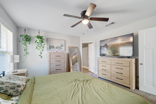 bedroom featuring visible vents, a ceiling fan, and carpet flooring