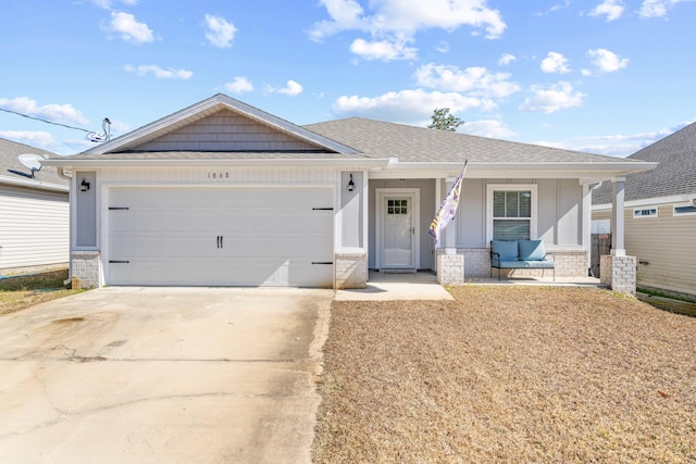 ranch-style house featuring driveway, a porch, an attached garage, and a shingled roof