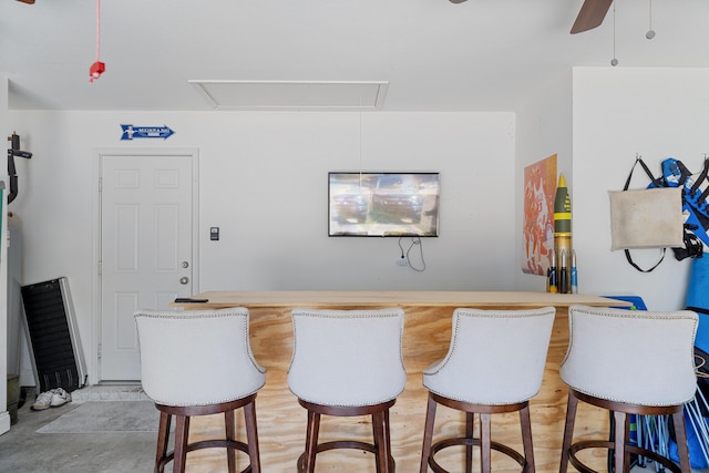 bar with a bar and ceiling fan