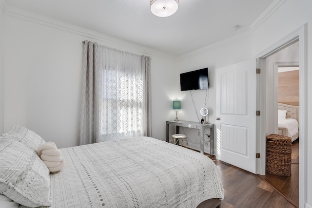 bedroom featuring dark hardwood / wood-style flooring and crown molding