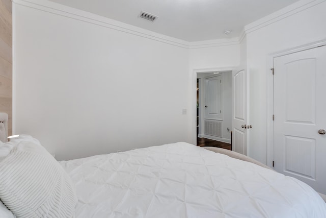 bedroom featuring crown molding