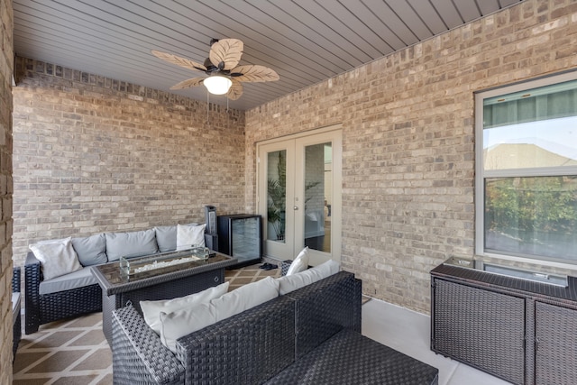 view of patio / terrace featuring an outdoor hangout area, ceiling fan, and french doors