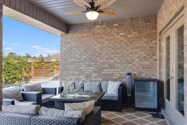 view of patio featuring an outdoor living space and ceiling fan