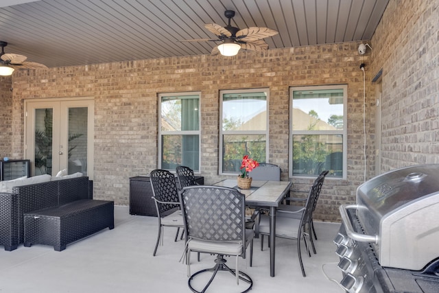 view of patio / terrace with ceiling fan, french doors, and a grill