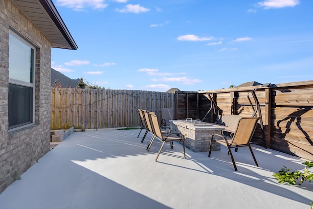 view of patio / terrace featuring a fire pit