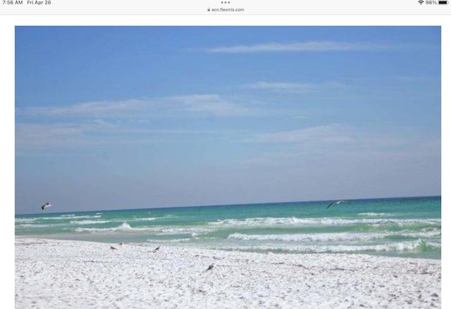 view of water feature with a beach view